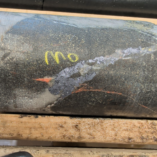 2.78% Cu, 0.054 g/t Au, 13.4 g/t Ag,  0.27% Mo from 260.7 m to 261.35 m