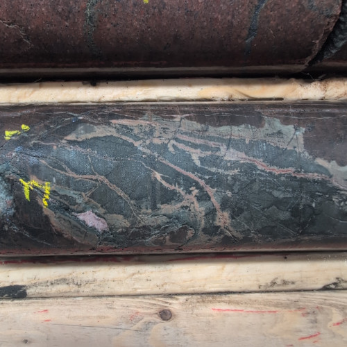 1.5% CuEq, 0.79% Cu, 1120 Mo_ppm, 0.06 g/t Au, 7.6 g/t Ag, from 185m to 186m