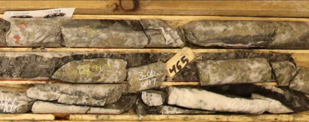 Chalcopyrite-rich quartz breccia in SC-26-13 at approximately 465 m downhole within a 7.4m interval grading 1.13% Cu, 0.076g/t Au, 14.8g/t Ag and 259.5ppm Mo